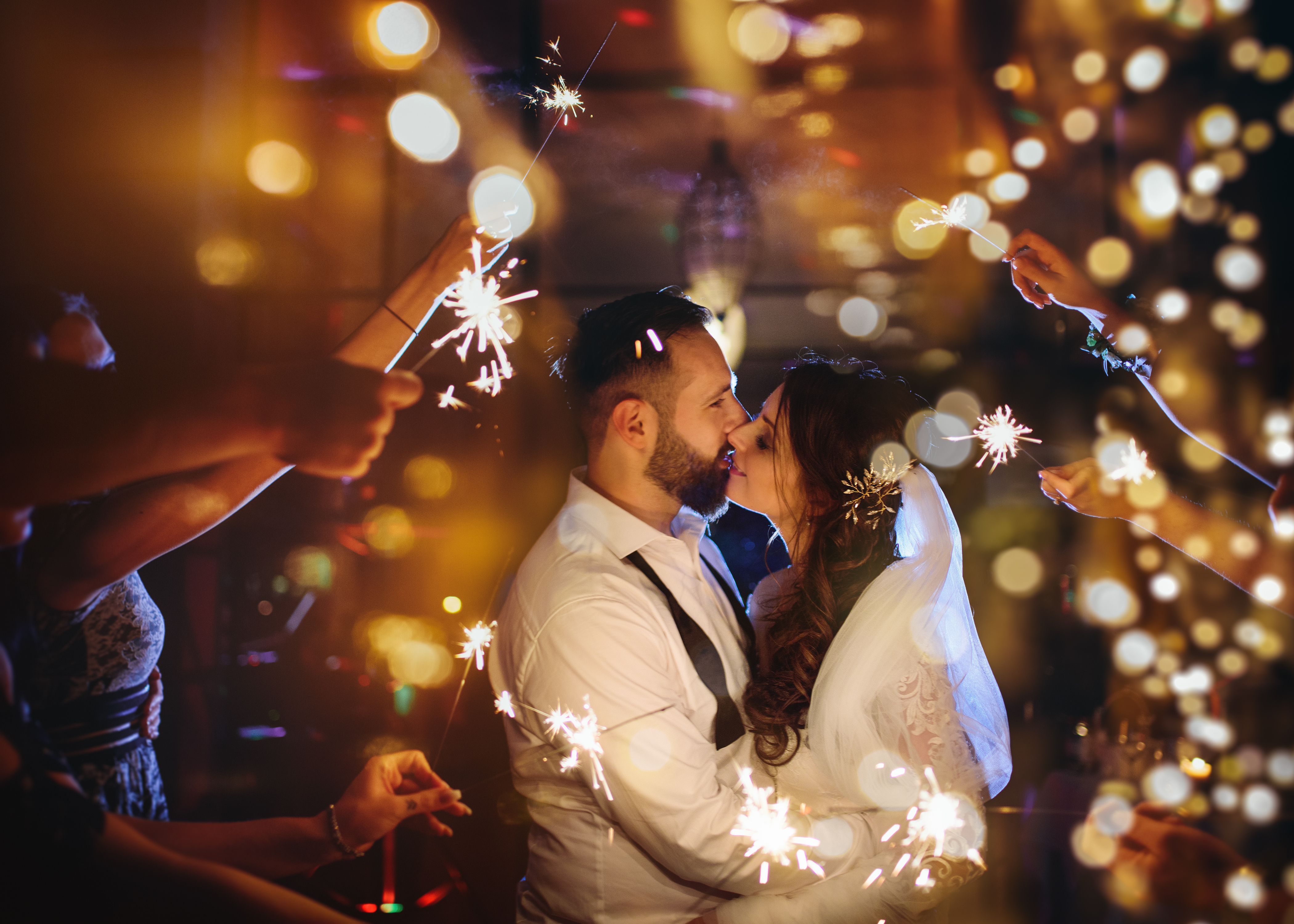 Wedding couple surrounded by sparklers at Melbourne reception