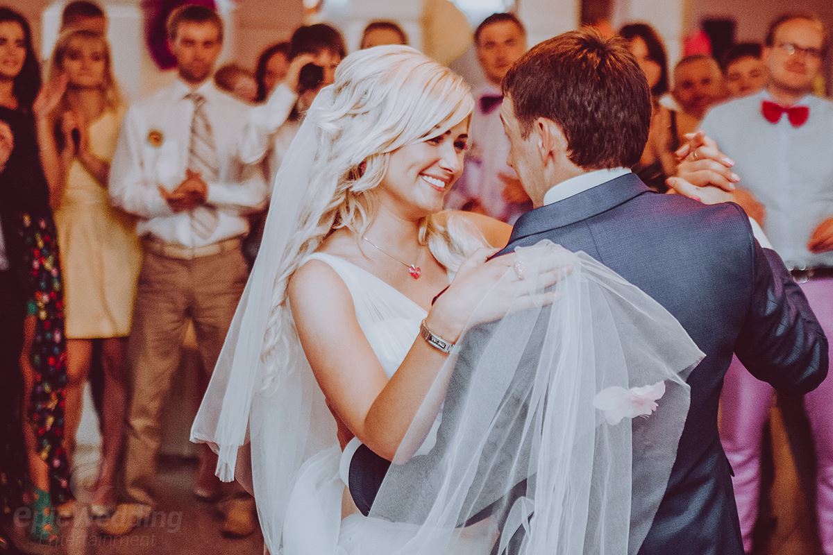 Bride and groom sharing first dance surrounded by guests at Melbourne wedding reception