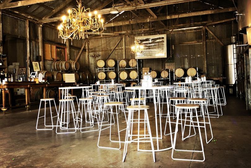 Live jazz trio with saxophone and vocalist at a brick warehouse venue