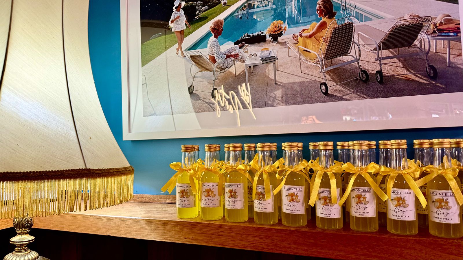 Poolside bar styled with bottled cocktails for a wedding