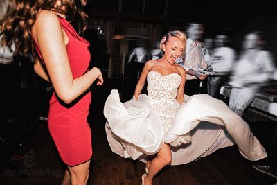 Bride twirling her dress on the dancefloor